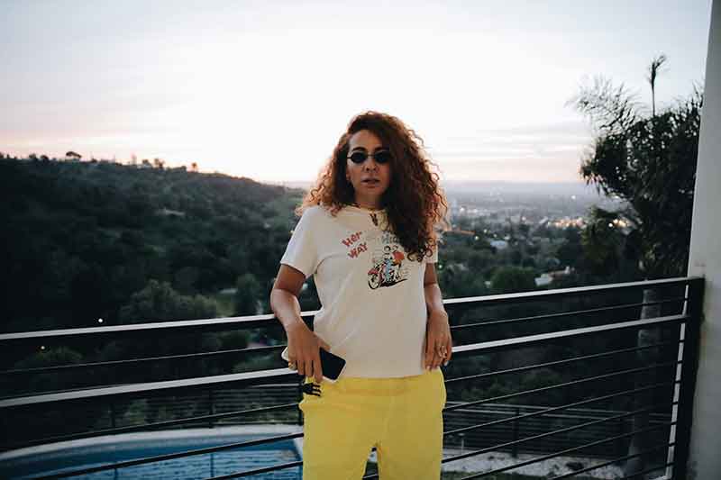 Woman on balcony overlooking Encino, CA